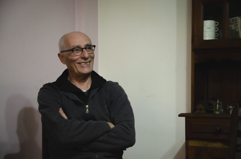 Lopecito sits at his Remedios de Escalada house.